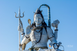 The 108 feet statue of Lord Shiva encircled and supported by a girdle of twelve Jyotirlingams at Chardam in Namchi