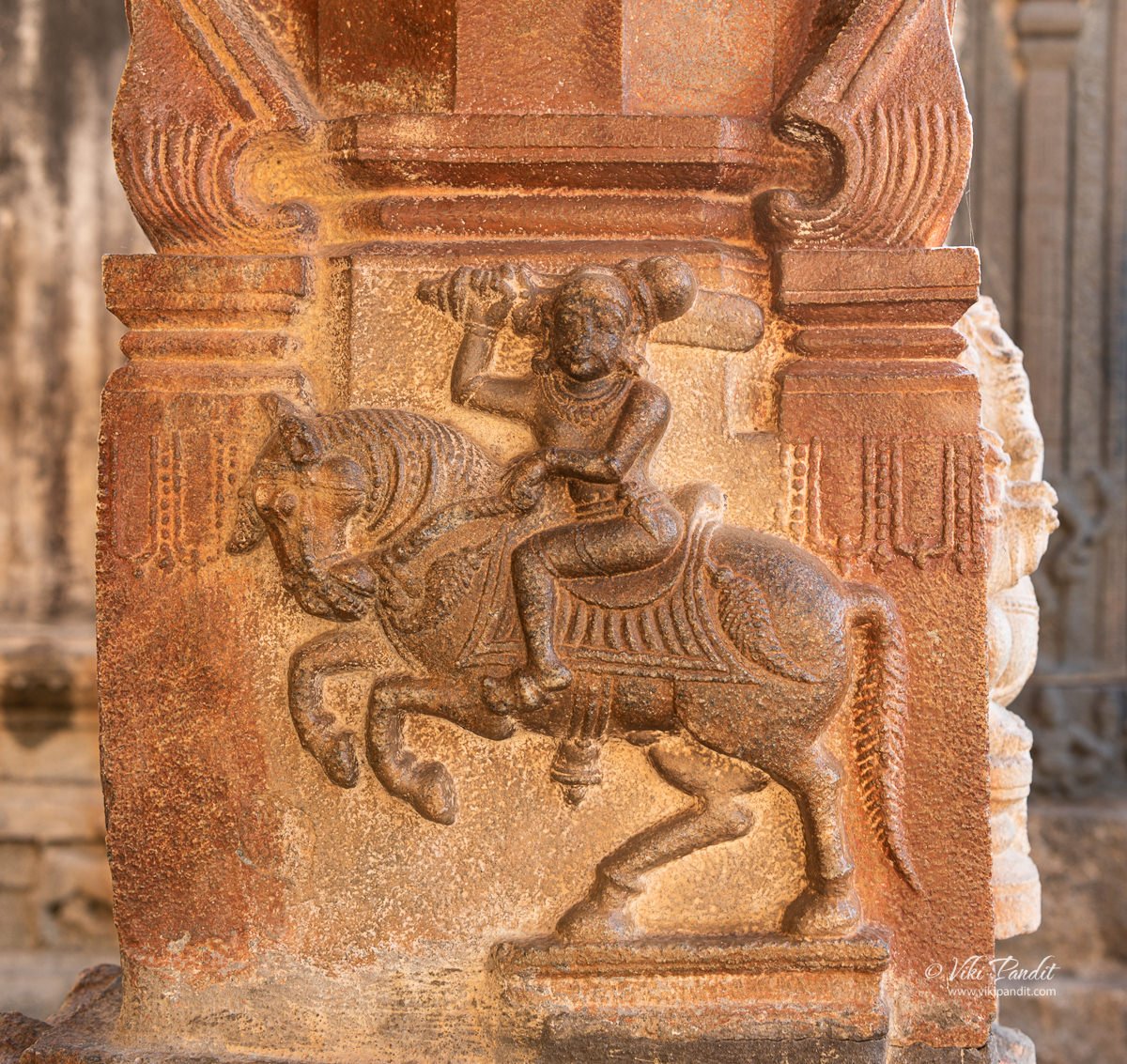 Carving of a warrior on the pillars leading to the Ramlingeshwara Temple