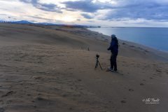 Setting up tripod to capture the sunset at Tottori sand dunes